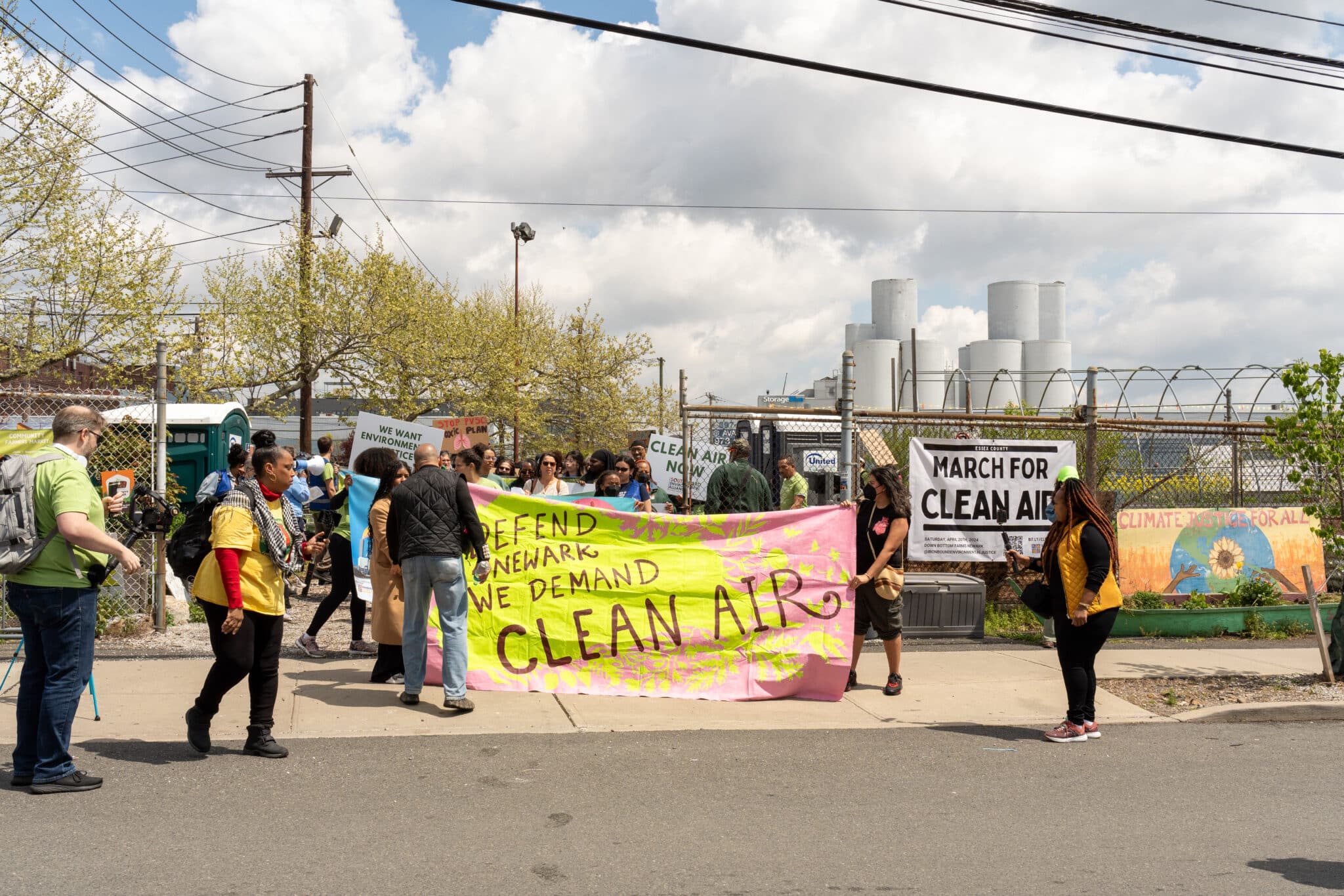 Community members join Ironbound Community Corporation's annual March for Clean Air, opposing a proposal to build a fourth fossil fuel power plant in Newark.